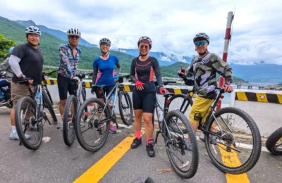 Cyclists taking picture at Hai Van Pass