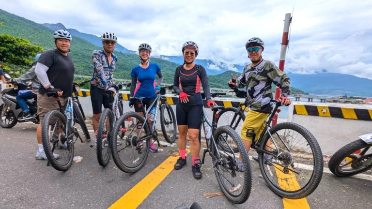 Cyclists taking picture at Hai Van Pass