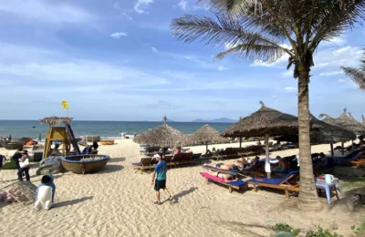 Tourists sun bathing in Cam An beach