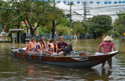 Tourists traveling in Hoi An flood