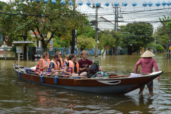 Tourists traveling in Hoi An flood